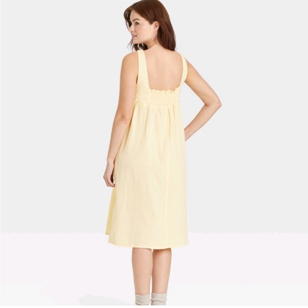 Stars above yellow babydoll midi dress